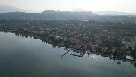 Aerial-View-Of-A-City-Port-Of-Cisano-With-Lago-di-Garda,-Province-of-Verona,-Italy