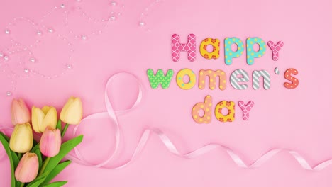 happy women's day text move on pink theme with flowers and ribbons. stop motion