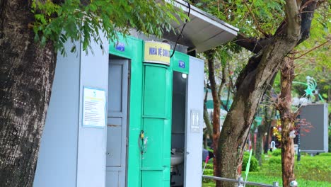 public restroom amidst trees in hanoi, vietnam