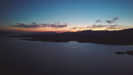 sunset in montalegre behind the mountains, portugal - drone shot aerial view at night