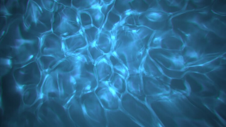 Sfondo caustico di acqua tropicale blu e pura