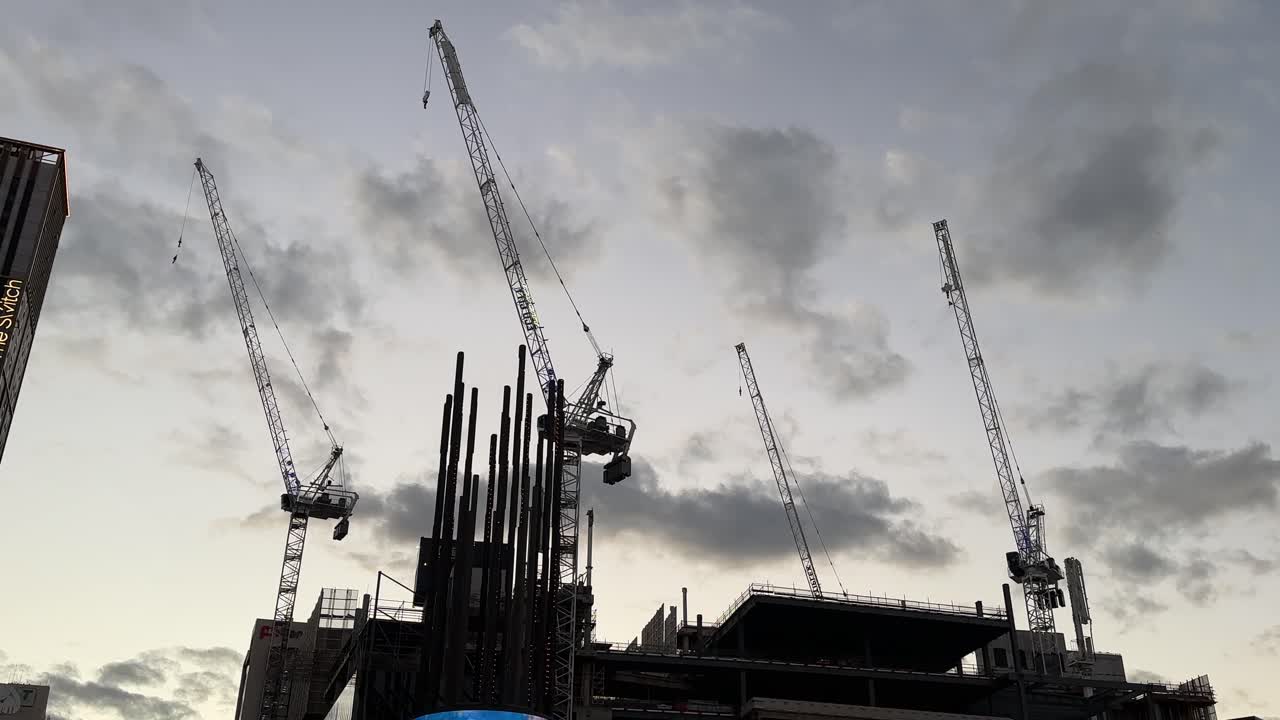 Cranes in Perth - city skyline Western Australia - closeup silhouette at Twilight