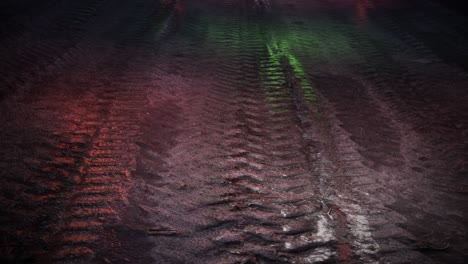 tire tracks on a dirt road at night