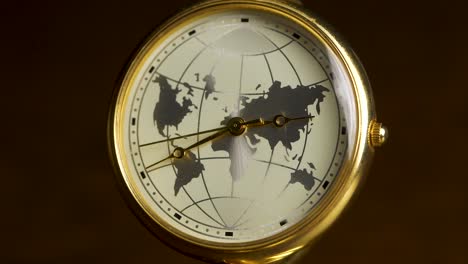 gold wristwatch with world map design