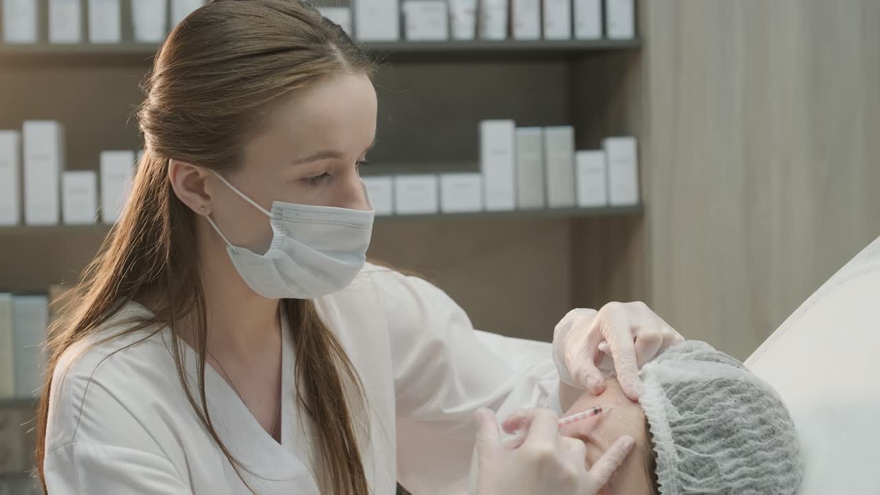 Cosmetologist Performing Facial Injection Procedure