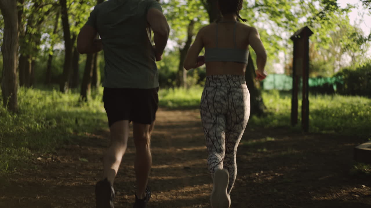 Couple running in forest