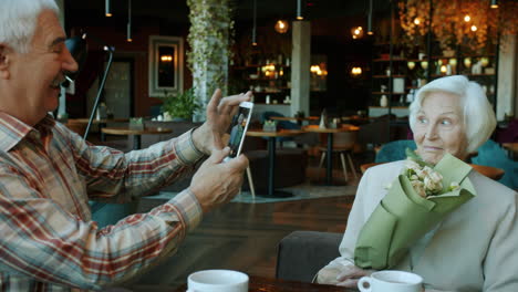 senior couple celebrating in a restaurant