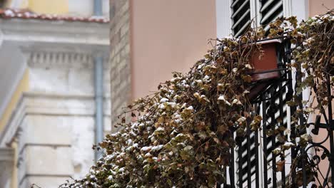 snow on the balcony of a house in guardiagrele, abruzzo, italy