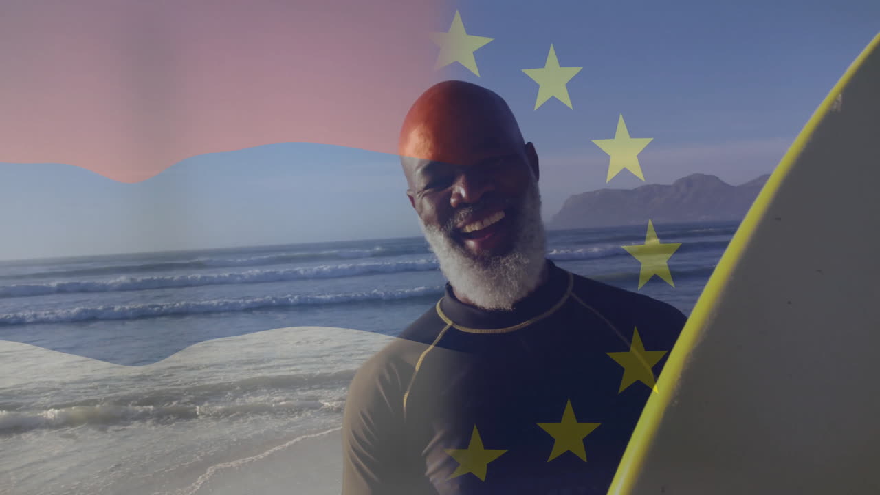 Homem em pé na praia, segurando prancha de surfe com animação das estrelas da União Europeia