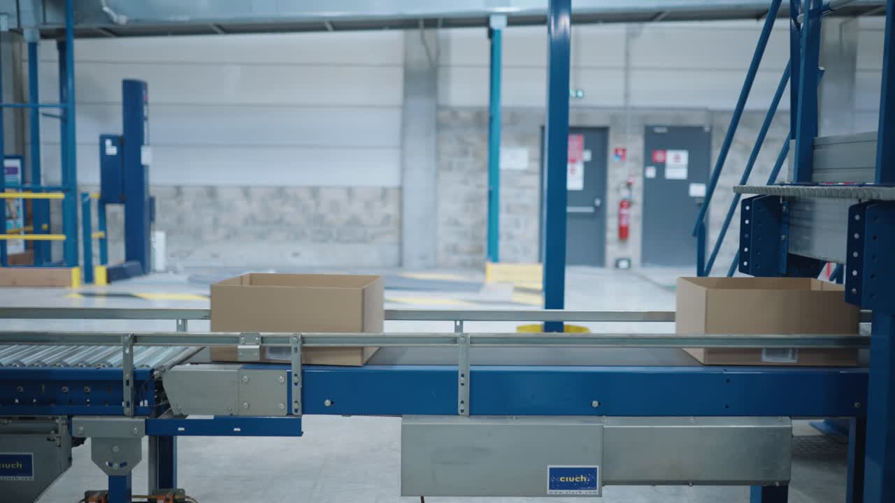 Boxes moving along a conveyor belt in factory in France
