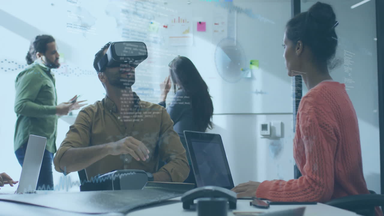 Team testing virtual reality tech in office, displaying floating code overlays around VR headset