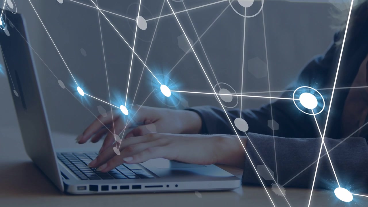 Woman typing on laptop for business, initiating network overlay growing over keyboard, then pausing