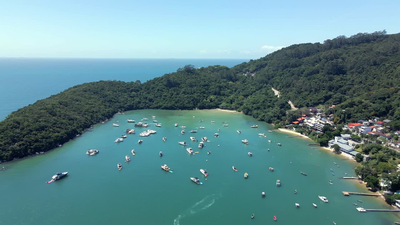 Aerial View of Caixa D’Aco in Santa Catarina, Brazil - Anchored Boats On Serene Bay Surrounded By Dense Forest.