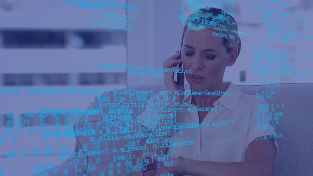 Data processing against caucasian woman smiling while talking on smartphone at office