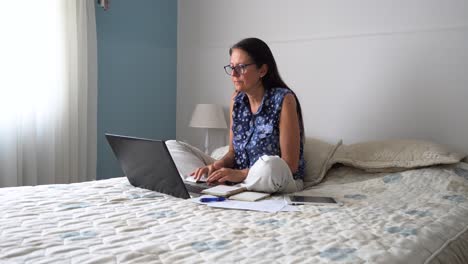 middle aged woman working from home during pandemic, remote working on laptop