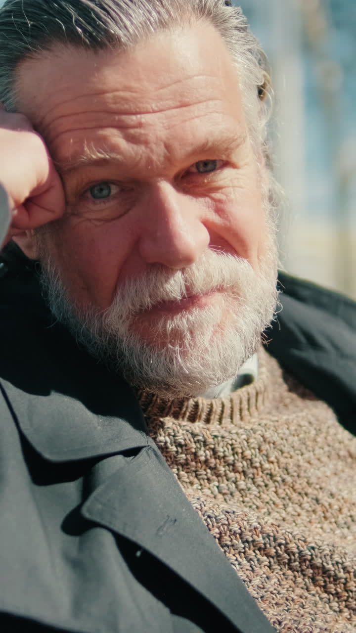 Thoughtful Senior Man Sitting in a Park