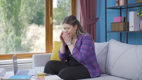 Emotional-young-woman-watching-outside-the-window.