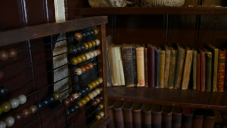 abacus and old books in victorian school classroom