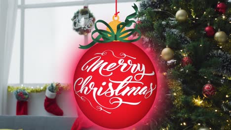 animation of merry christmas text in bauble over christmas tree