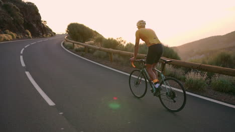 in slow motion, the cyclist athlete ascends a mountain serpentine, reveling in the island's stunning view—a true portrayal of a healthy lifestyle