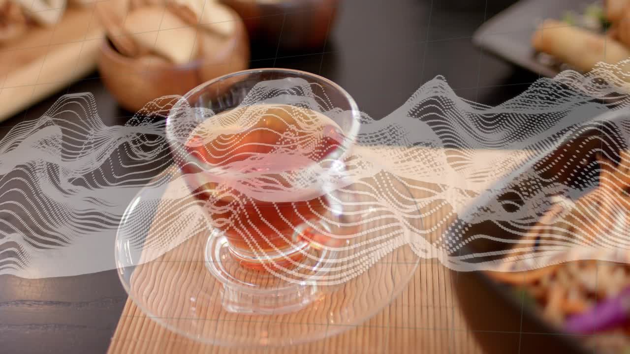 Clear glass teacup shifting center during camera pan, overlay drifting, gaining focus to draw gaze