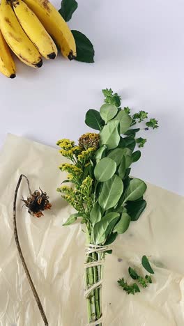 arrangement of bananas and flowers