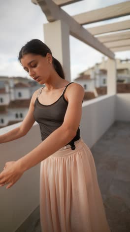 teenage ballet dancer on balcony