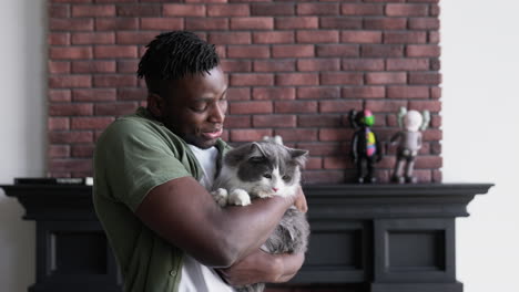 pet owner holding his cat