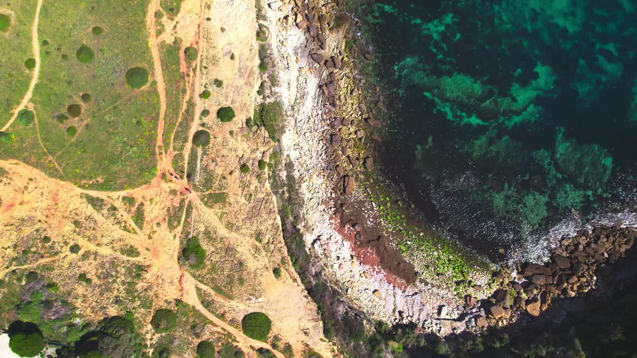 People On The Rocky Shores Of Tropical Beaches In Algarve, Portugal. Aerial Ascending Shot