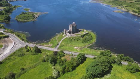 aerial view of the medival dunguaire castle in the shore of galway bay during a sunny summer day in co. galway - ireland