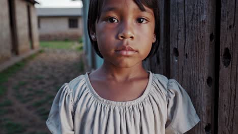 portrait of a young girl in a rural setting
