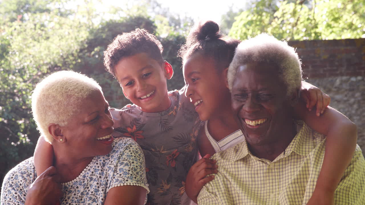 Senior black couple and grandchildren outdoors, close up