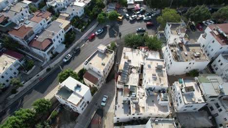 top down drone shot of bodrum town with cars and houses