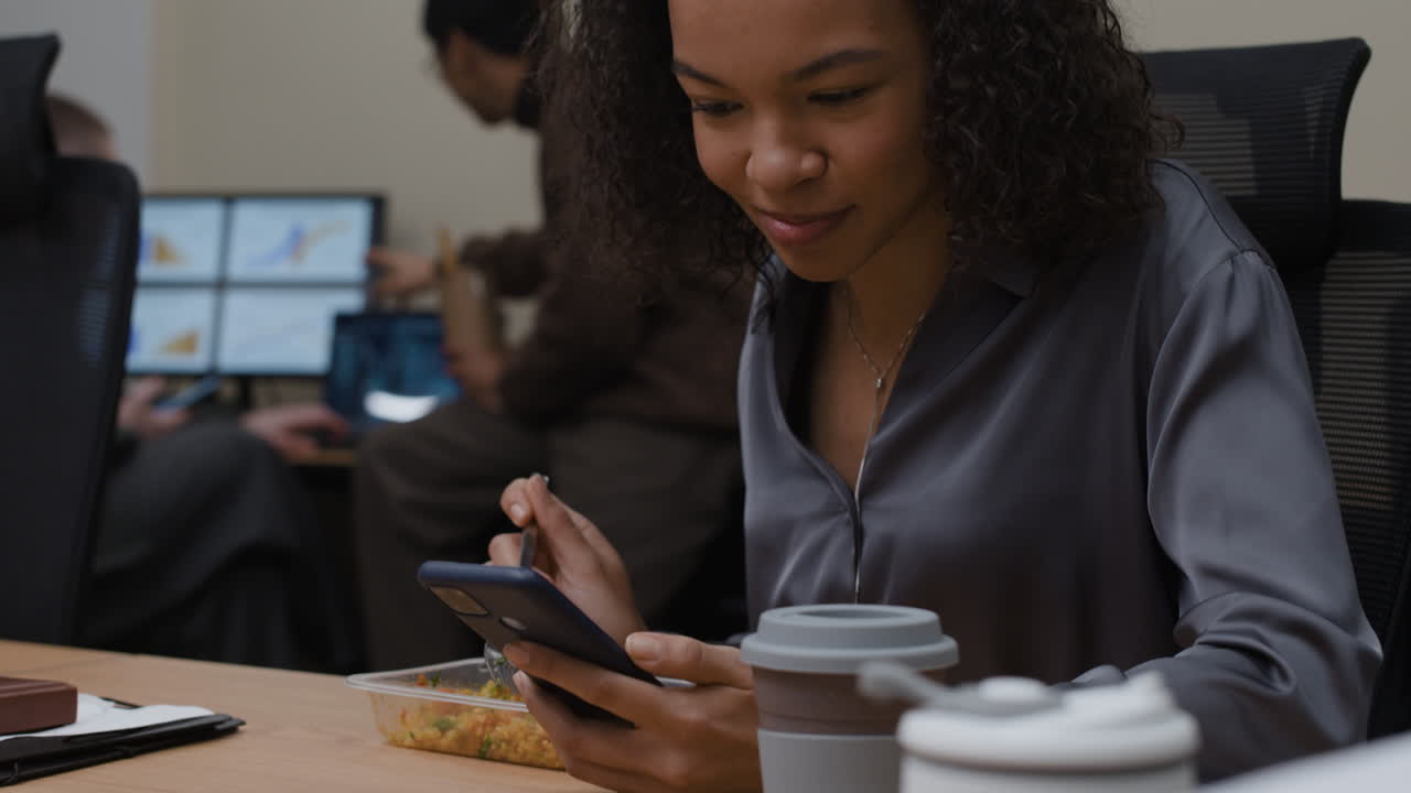 Woman eating lunch at her office