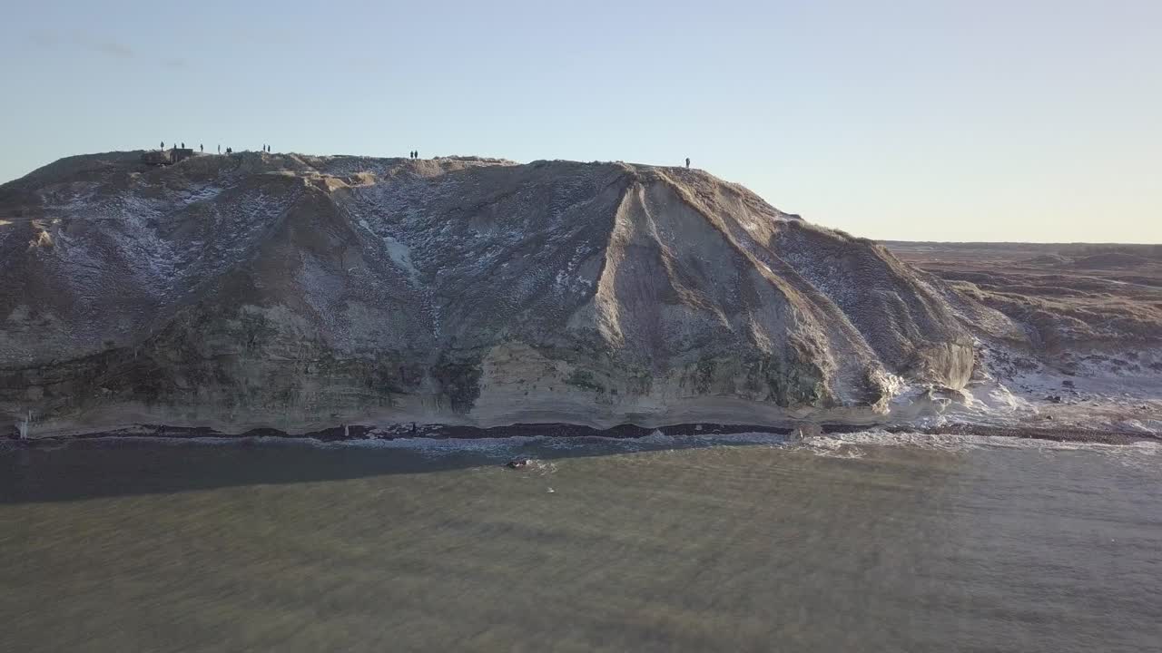 Drone Aerial View of Bulbjerg Fuglefjeld and Bunker with snowy tops in North Jutland, Denmark