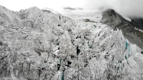 aerial flyover into and through crevasses of the moiry glacier near grimentz in valais, switzerland afternoon