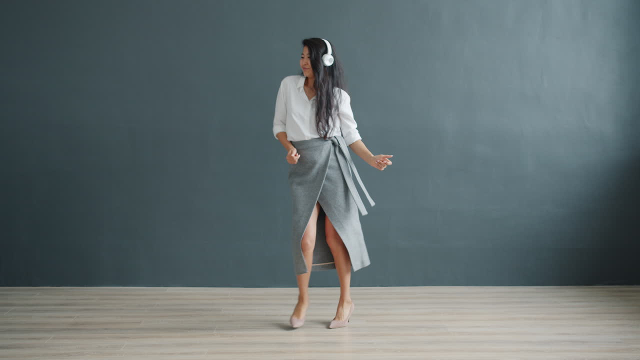 Happy Businesswoman Dancing in Office