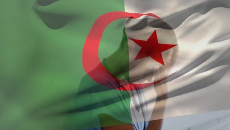 Digital-composition-of-algeria-flag-waving-over-stressed-caucasian-female-health-worker-at-hospital