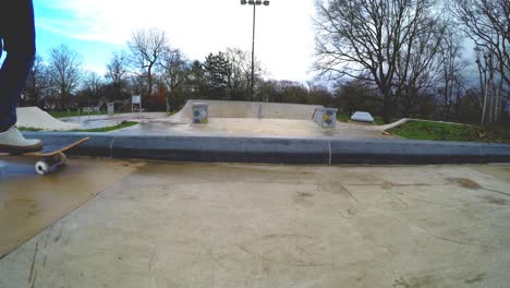 A-skateboarder-is-seen-attempting-a-grind-trick-with-both-trucks-on-a-small-ledge-but-failing-as-the-trucks-slipped-away-and-the-skateboards-falls