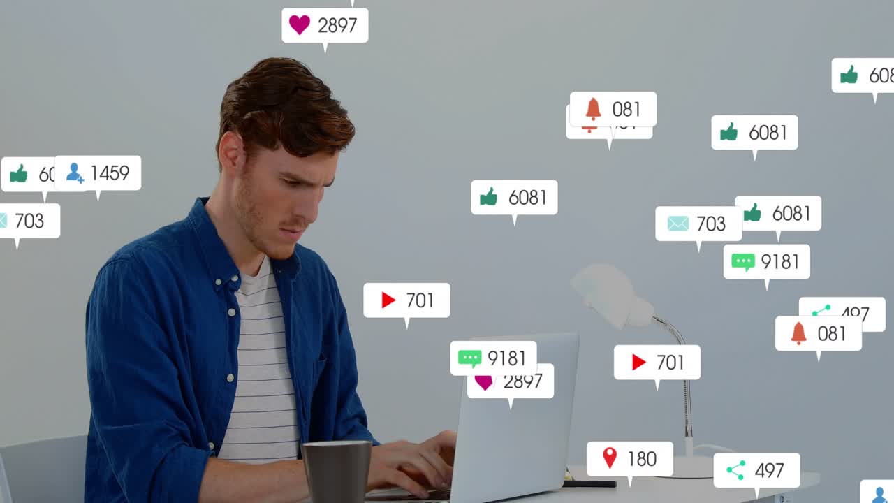 Vertical video: Icons arriving, man in blue shirt typing to reply on laptop at desk, copy space