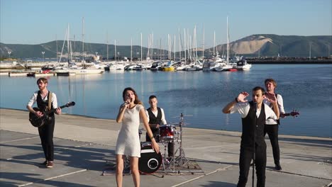 band performing live at a marina