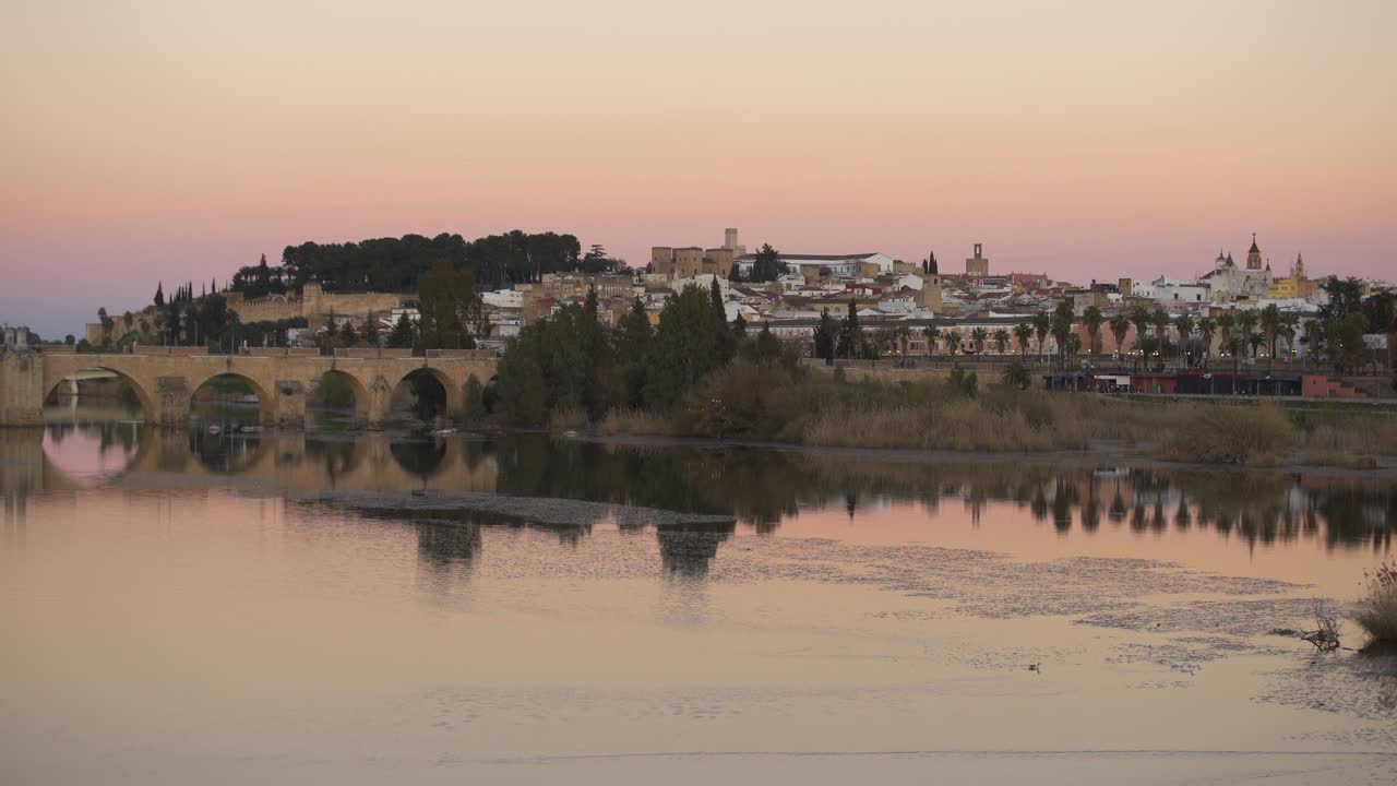 Badajoz city at sunset with river Guadiana in Spain