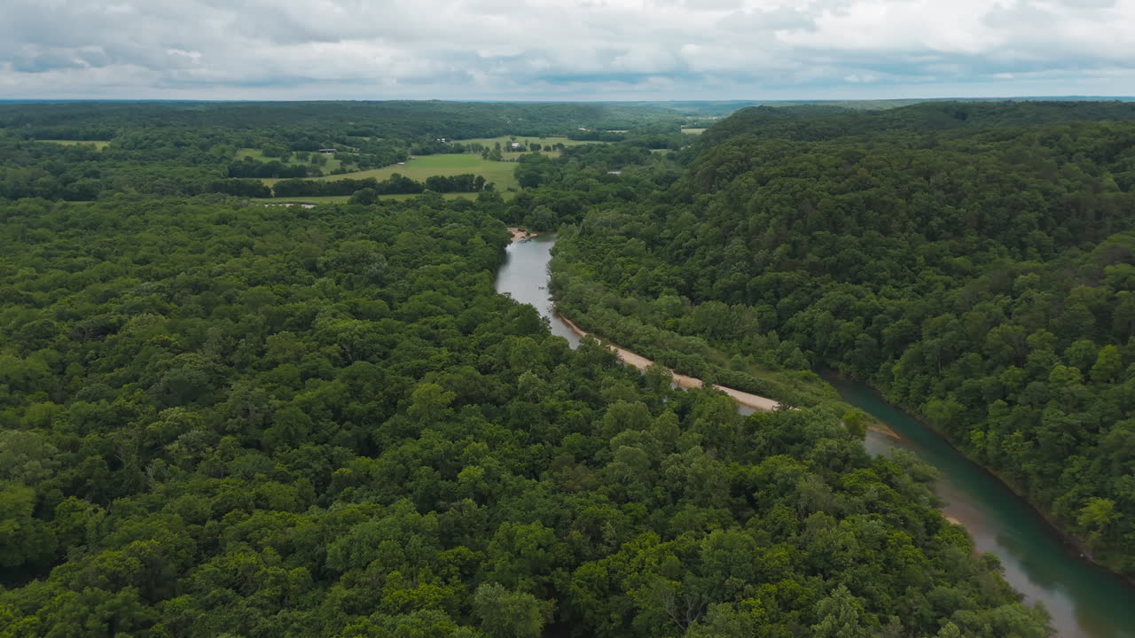 Elevated wooded ridge surrounds river meandering with sandy banks, Tagg Flats, Lake Eucha Oklahoma USA