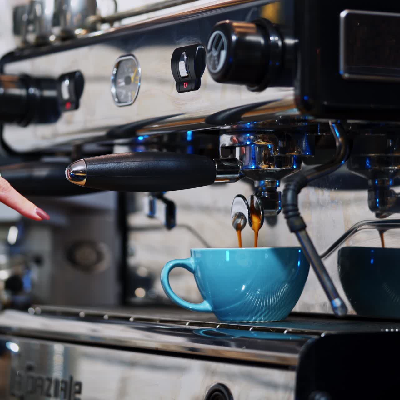 Barista making coffee in coffeeshop