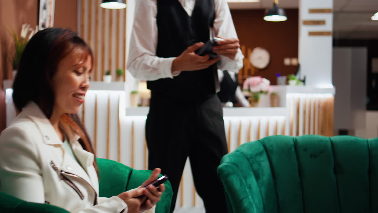 Hotel guest paying by nfc mobile network at pos