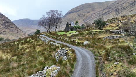 Ruins-in-Irish-Valley---County-Kerry,-Killarney-National-Park---Stabilized-droneview-in-4K