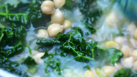 close up of kale and chickpeas soip cooking