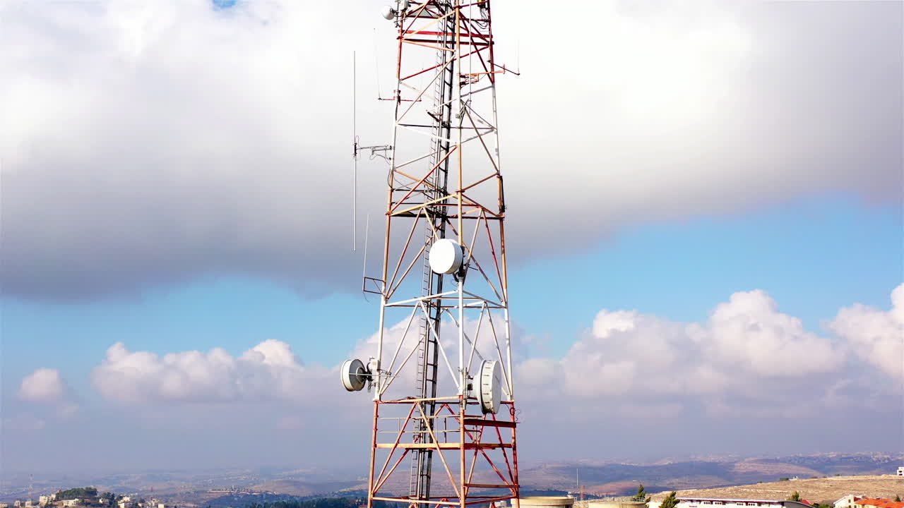 Aerial footage Close to cellular Antenna with blue sky and Clouds