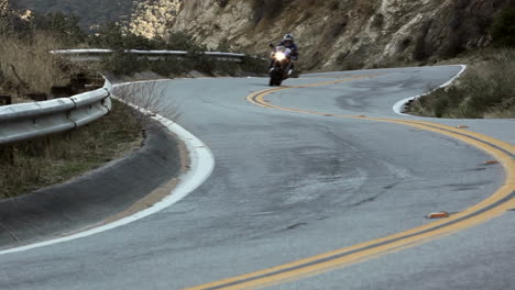 motorcycle and cars on winding mountain road 5