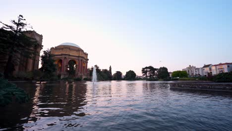 palace of fine arts by the lake during sunset